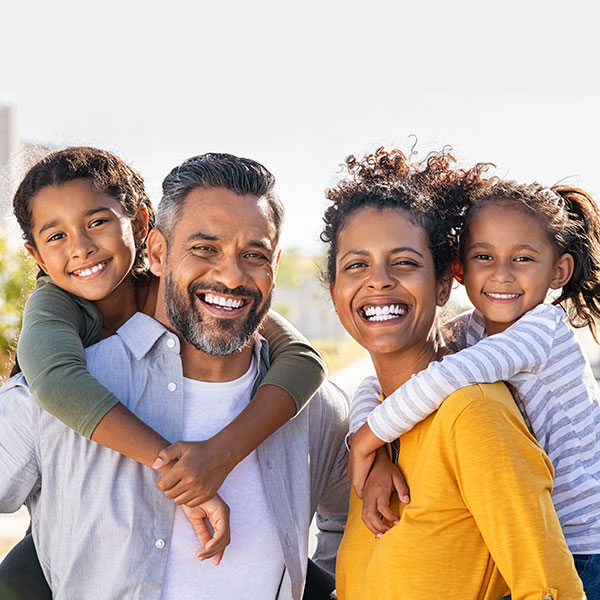 Family Smiling Outdoors Family Smiling Outdoors